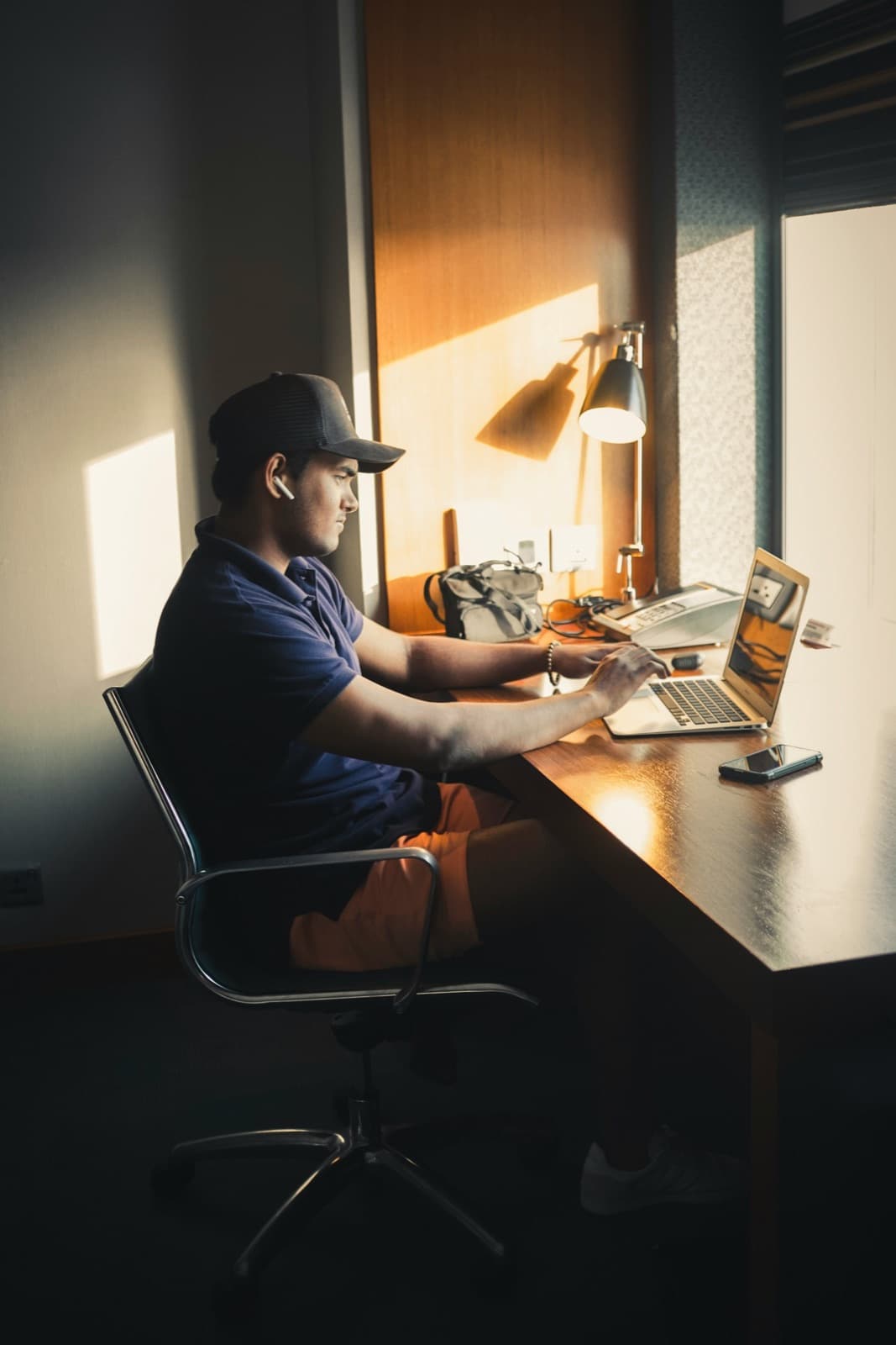 A specialist working at his desk at home