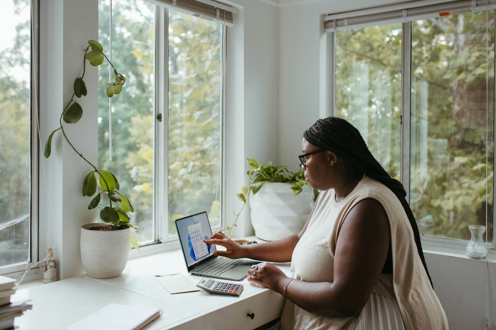 A specialist working from a bright home office