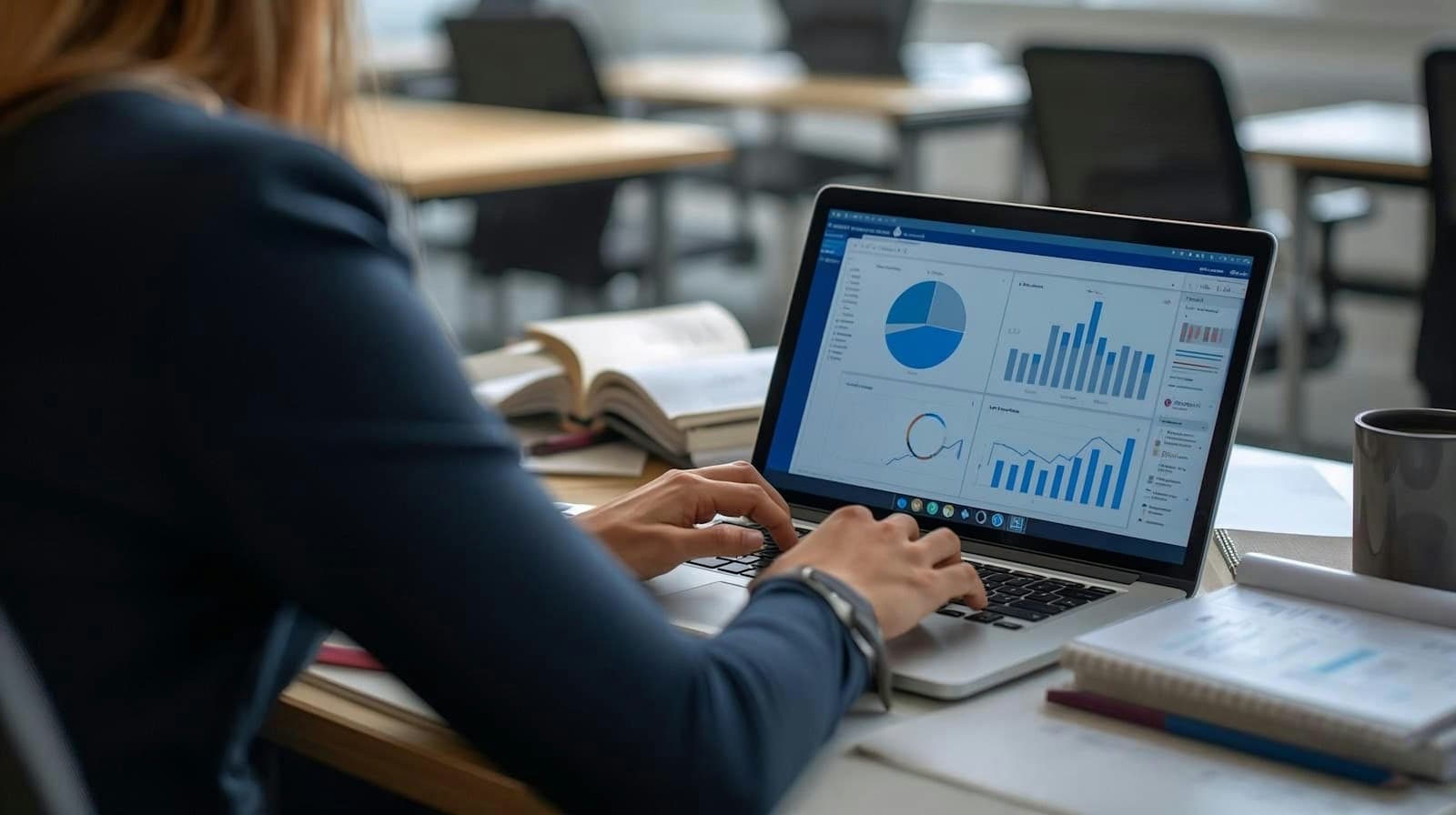 A marketer reviewing charts on a laptop